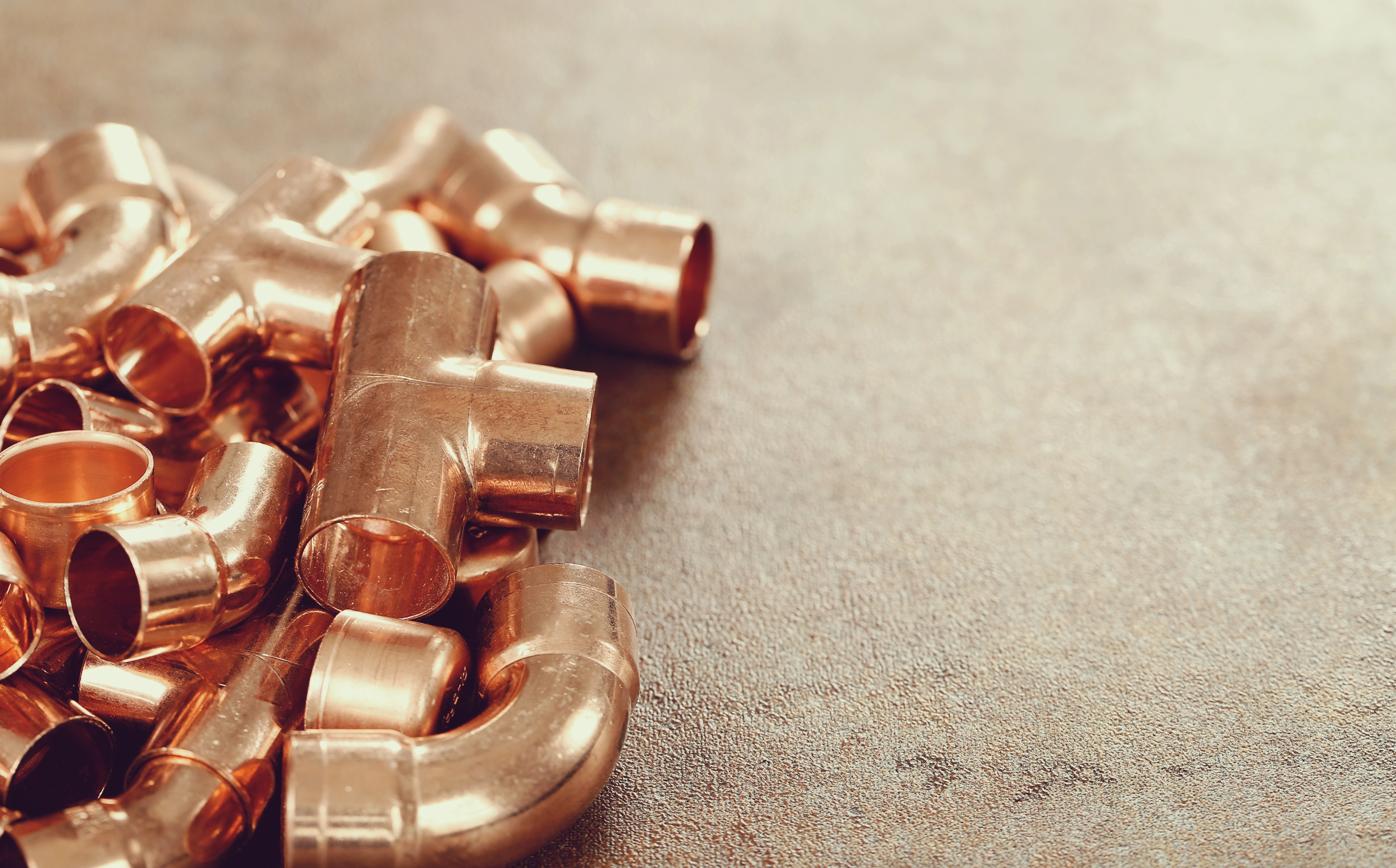 Collection of copper pipes and T-fittings for metal recycling